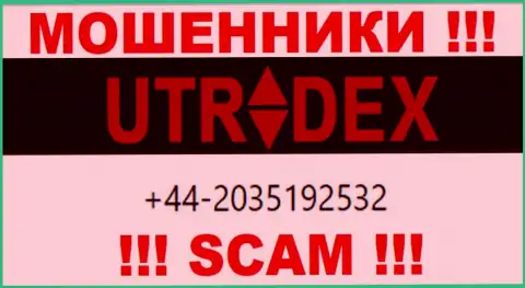 У UTradex далеко не один телефонный номер, с какого будут трезвонить неведомо, осторожно